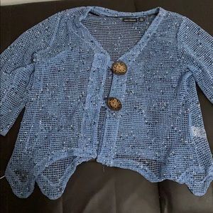 Transparent knitted beach poncho